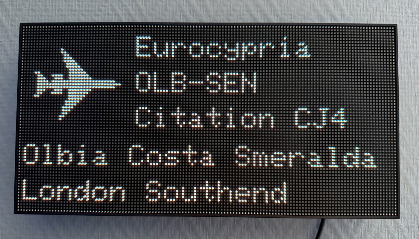 Airport-style flight information display showing an incoming private jet