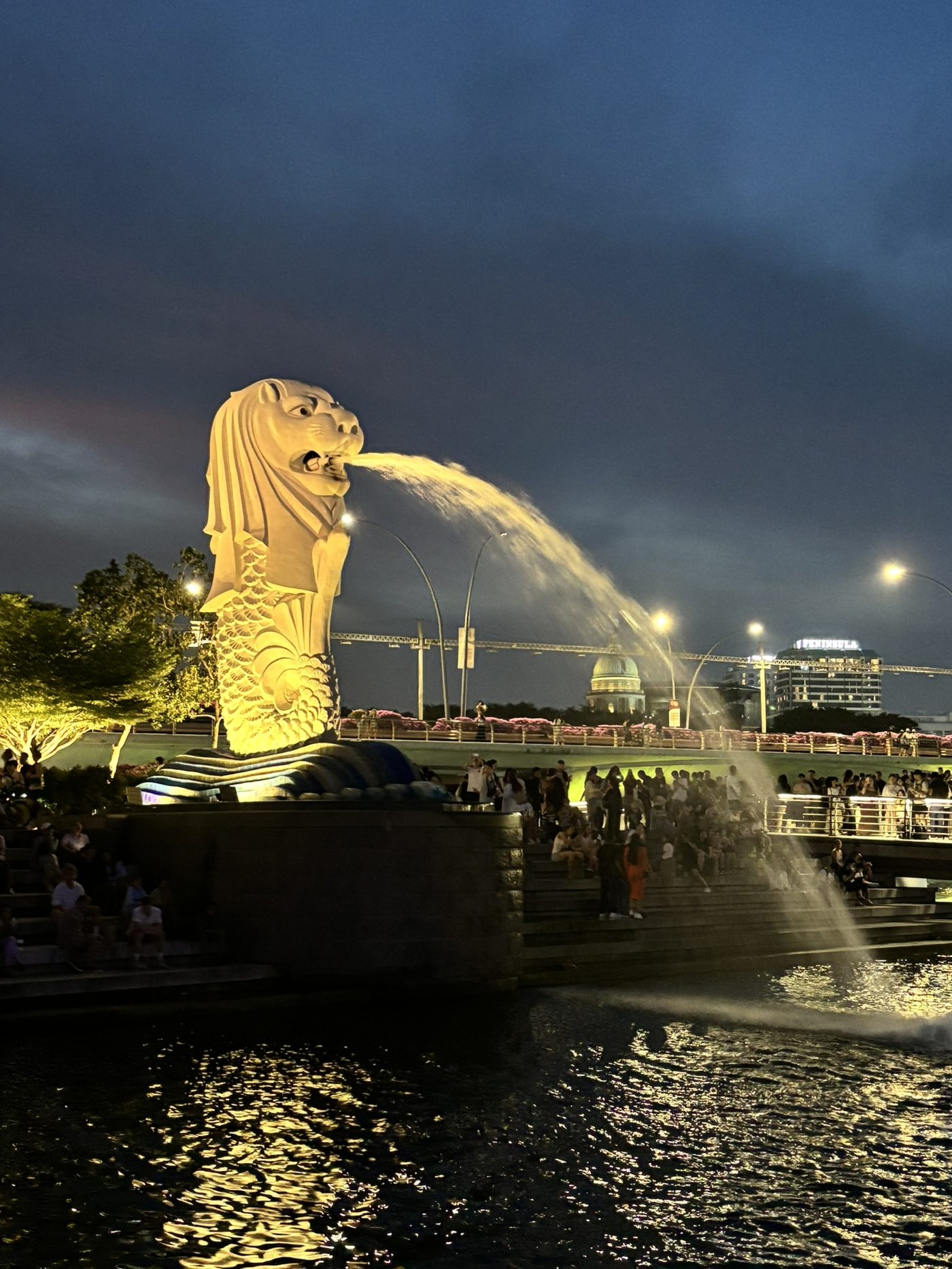 The Merlion statue lit up at night in Singapore