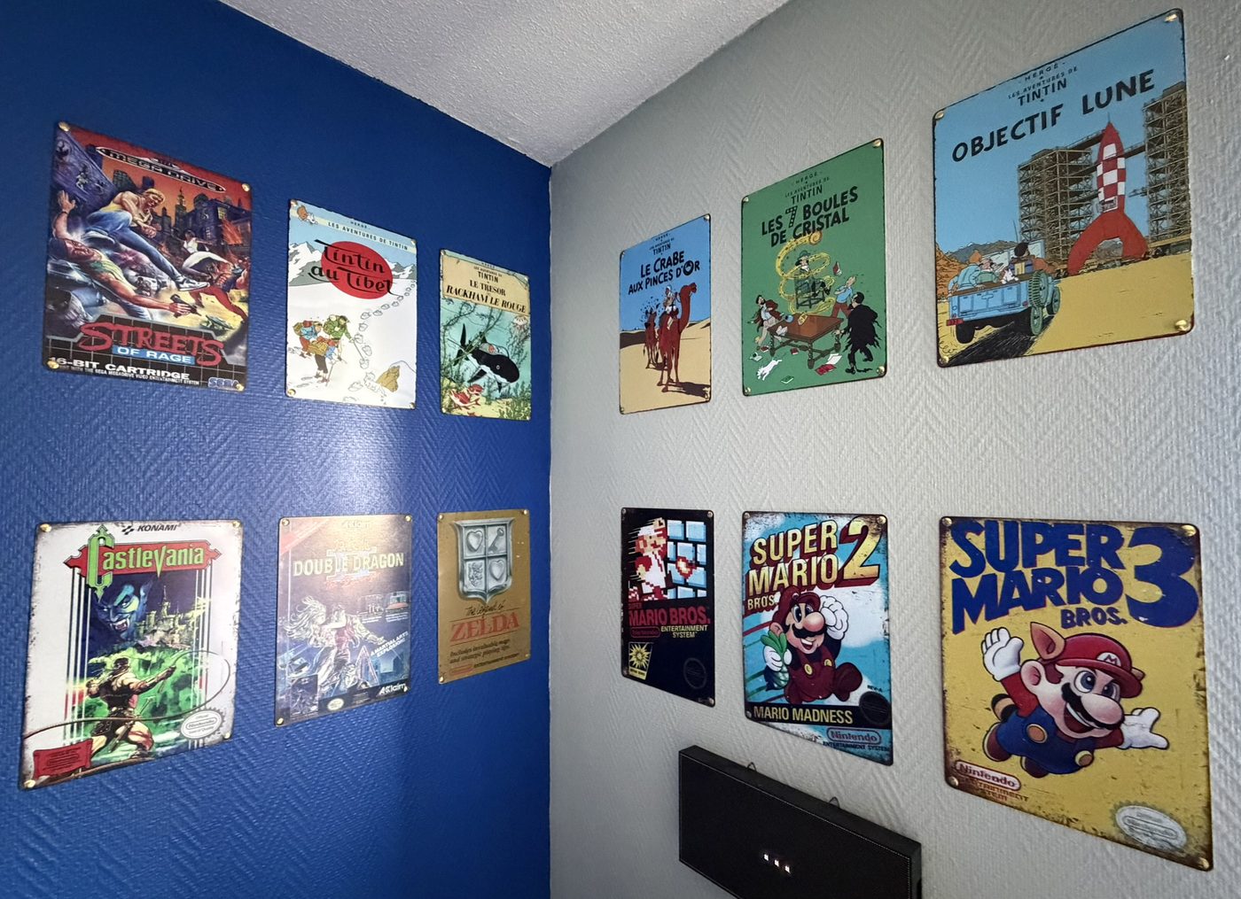 A wall decorated with classic retro video game posters